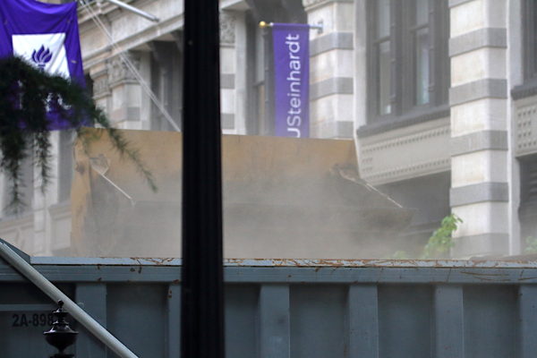 NYC construction dust from deposited material in truck