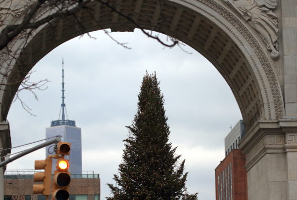 Washington Square Park Christmas tree and One World Trade seen under the park arch