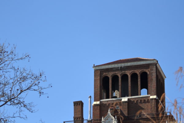 Sadie Hawk sitting on Washington Square Park building corner